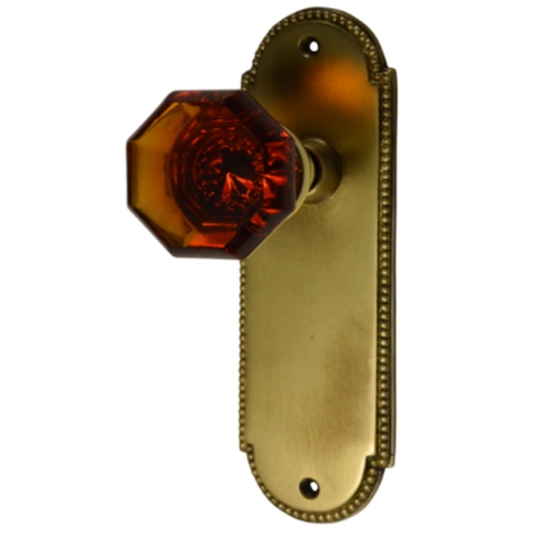 Arched Beaded Backplate Door Set with Octagon Amber Glass Door Knobs (Several Finishes Available) COPPER MOUNTAIN HARDWARE
